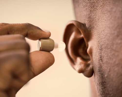 Torga audiologist helping a patient hear the difference with professional hearing care